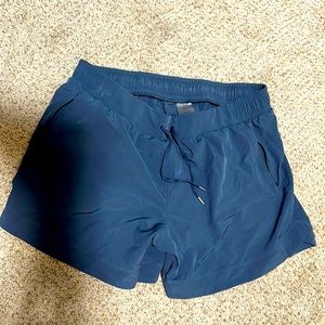 Blue athletic shorts by Calia